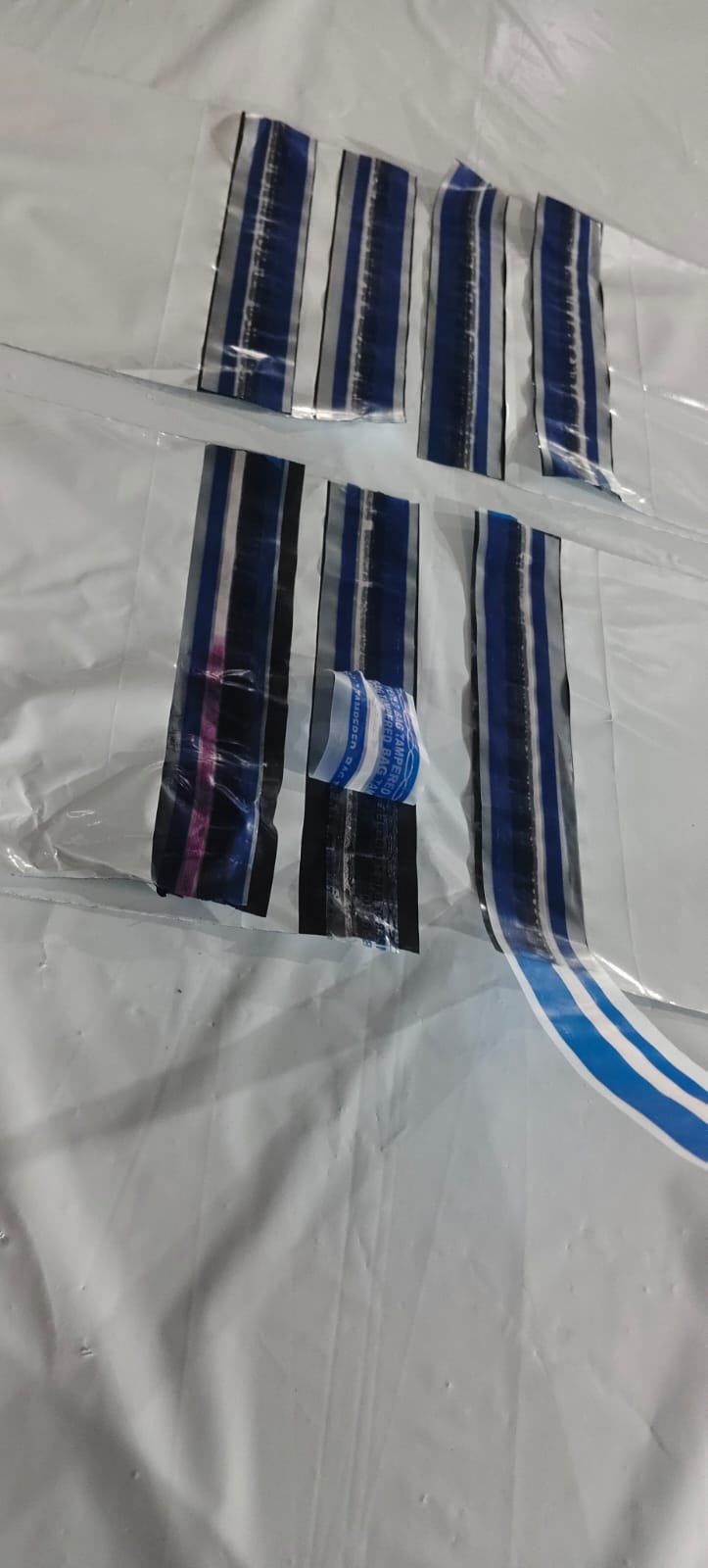 Applied Level 4 seals where one strip shows the heat indicator turned pink after heat was applied