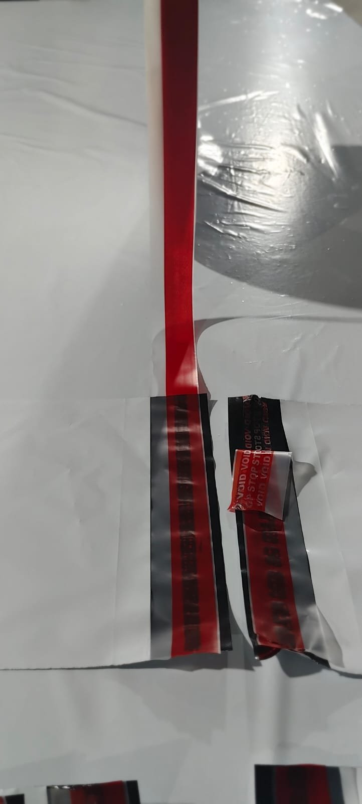 Opened bag seal showing a red VOID STOP message transferred across the separated layers
